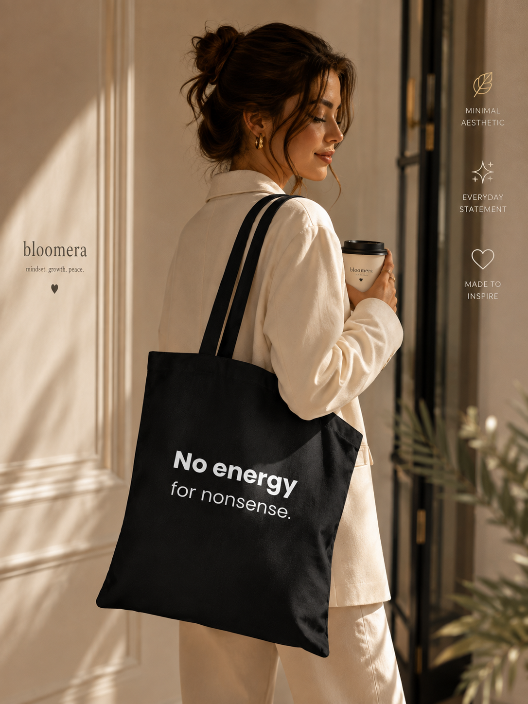 Woman carrying a black canvas tote bag with "No energy for nonsense" text while holding a coffee